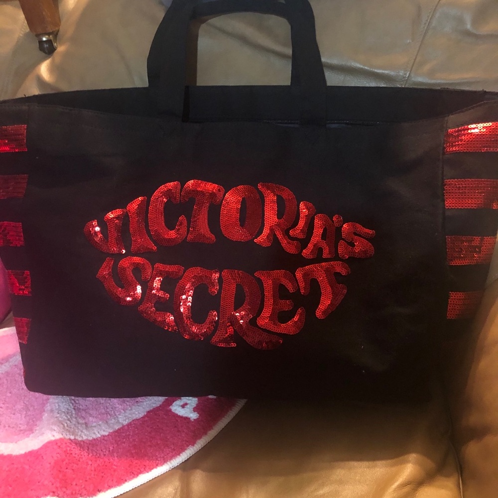 Victoria’s Secret bag is red and black.